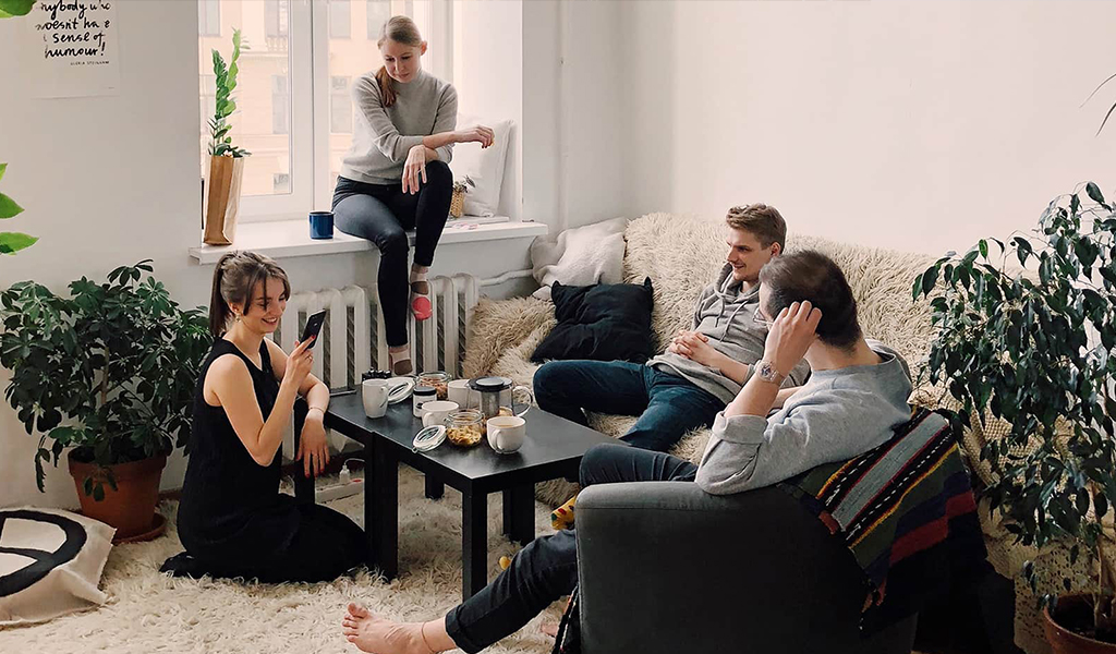 A group of VPS guardians in a living room of a rental property